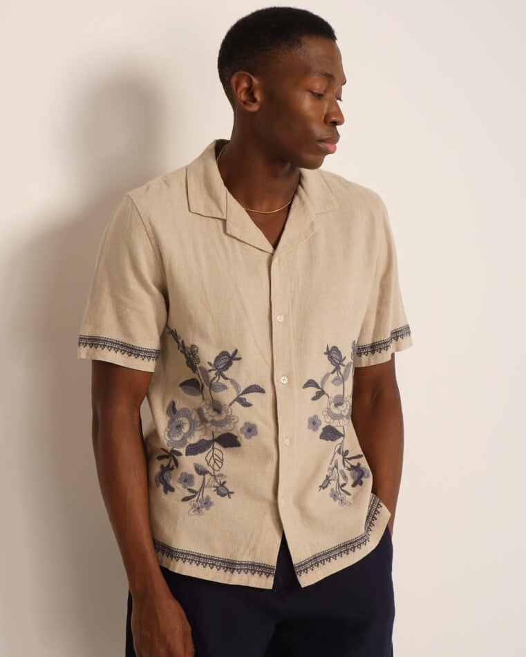 Man in floral embroidery camp shirt